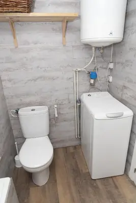 a bathroom with a toilet and a water tank at Faromar, I-10-M in Cullera