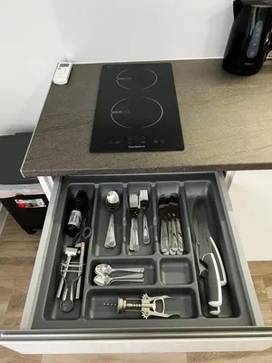 a tray filled with utensils in a kitchen counter at Rodrigues 15 in Valencia