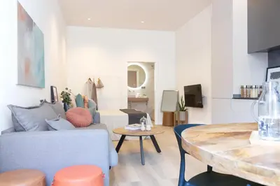 a living room with a couch and a table at VLC HOST - Cubells in Valencia