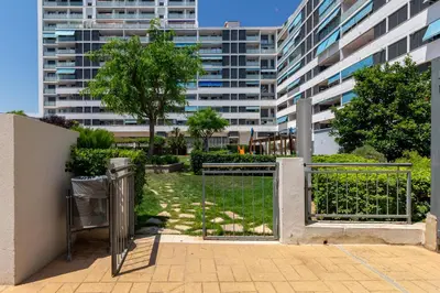 a gate in front of a tall building at Calatrava by Alma Suites in Valencia