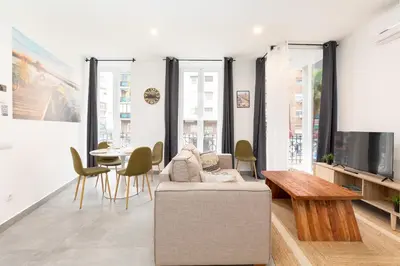 a living room with a couch and a table at Belmar Apartments in Valencia