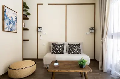 a bedroom with a bed and a coffee table at Le Japonais de COUP DE COEUR APPARTEMENTS in Valencia