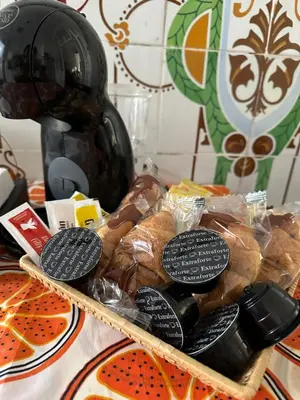 a tray of bread and cookies on a table at Habitación con Baño privado 1 cama de matrimonio in Valencia