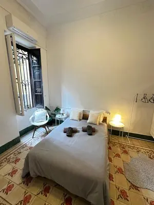 a bedroom with a large bed in a room at Habitación con Baño privado 1 cama de matrimonio in Valencia