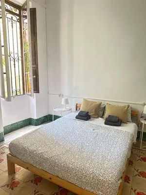 a bedroom with a large bed in a room at Habitación con Baño privado 1 cama de matrimonio in Valencia