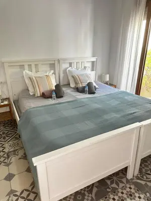 a large white bed in a room with a window at Habitación doble en Ruzafa con baño privado in Valencia