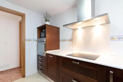 a kitchen with a sink and a counter top at Global Vacacional, Apartamento de 3 dormitorios en Sagunto in Sagunto