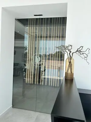 a vase sitting on a table in a room at DON LEONE Hotel in Alginet