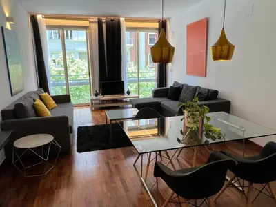 a living room with a couch and a table at Baron Suites in Valencia