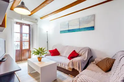 a living room with a couch and a table at apartamento con terraza in Valencia