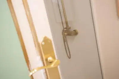 a door with a gold door knob on a white door at SingularStays San Valero in Valencia
