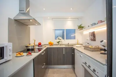 a kitchen with a sink and a counter top at SingularStays Gran Via in Valencia