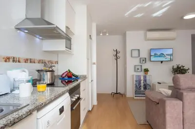 a kitchen and living room with a counter top at SingularStays Benimaclet in Valencia
