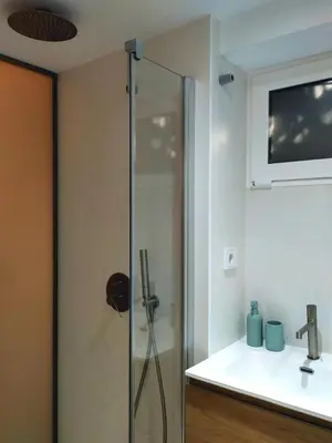 a glass shower in a bathroom with a sink at Estudio Pino en casco antiguo VALENCIAYOLE in Valencia