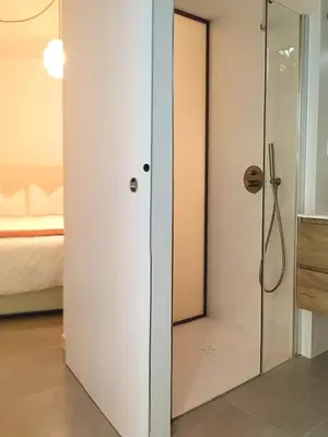 a bathroom with a shower with a glass door at Estudio Pino en casco antiguo VALENCIAYOLE in Valencia