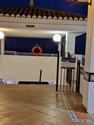 a basketball court with a net in a building at Apartamentos Bon Amb in Faro de Cullera