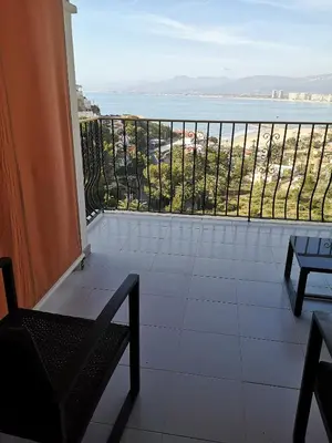 a balcony with a view of the ocean at Apartamentos Bon Amb in Faro de Cullera