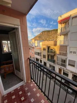 a balcony with a view of a building at RIU MAR Apartment Cullera in Cullera
