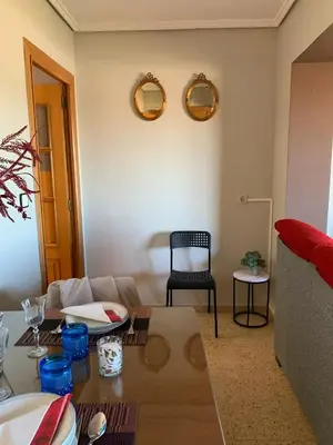 a table and chairs on a balcony with a view at Sagunto in Sagunto