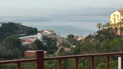 a view of the ocean from a balcony at Una casa con vistas in Faro de Cullera