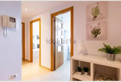 a room with a door and a hallway with plants at Vacaciones perfectas. in Paterna