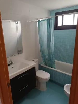 a bathroom with a toilet and a sink and a shower at Terraced house in natural essence in Favareta