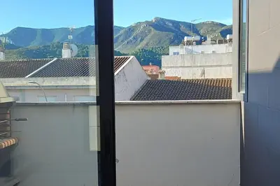 a view from an open window of a building at Terraced house in natural essence in Favareta