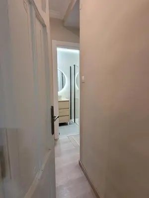 an open door leading to a bathroom with a mirror at La Casa Alandí con garaje privado in Sagunto