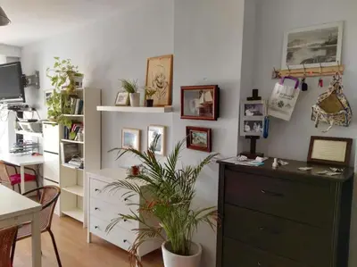 a room with a dresser and a plant in it at Luminoso piso en edificio de canet de berenguer in Canet de Berenguer