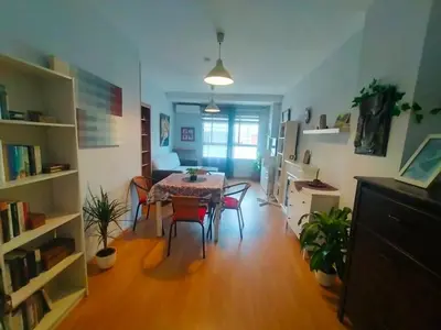 a dining room with a table and chairs in a room at Luminoso piso en edificio de canet de berenguer in Canet de Berenguer