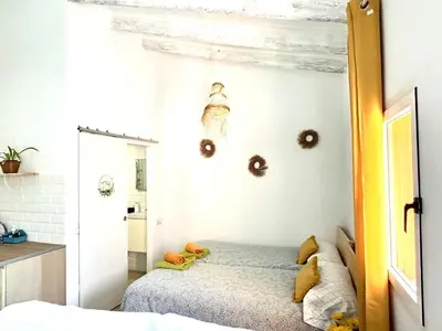a bedroom with a bed and a mirror at Loft C El Ramellet in Alginet