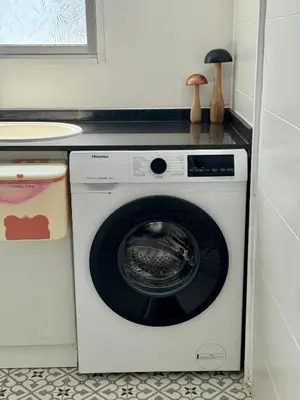 a washing machine in a kitchen with a counter at DJcumar Apartamento en Cullera comodo y bien ubicado in Cullera