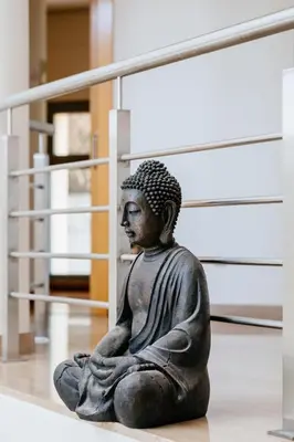 a statue of a buddha sitting on the floor at Lushville - Luxurious Villa with Pool in Valencia in Campo Olivar