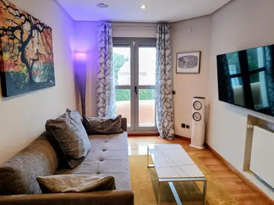 a living room with a couch and a table at Lushville - Luxurious Villa with Pool in Valencia in Campo Olivar