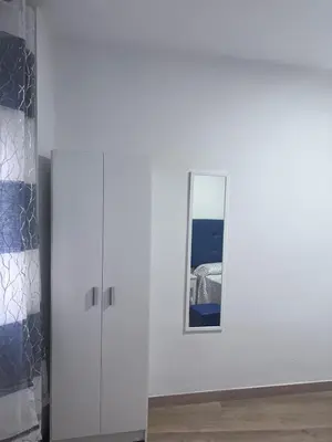 a room with a white cabinet and a mirror at Cantarranas in Requena
