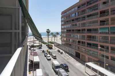 a view of a city street with a tall building at Amador, 4-J in Cullera