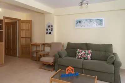 a living room with a couch and a table at Amador, 4-J in Cullera