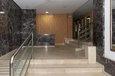 a hallway with stairs in a building at Amador, 4-J in Cullera