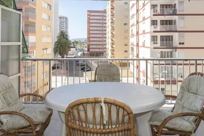 a white table and chairs on a balcony at Amador, 4-J in Cullera