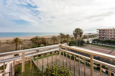a view of the beach from the balcony of a building at Alquiler de temporada Canet Playa - en primera linea in Canet de Berenguer
