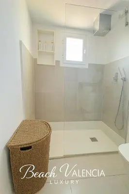 a bathroom with a shower with a glass door at BEACH VALENCIA LUXURY B7-23 Apartment with terrace and sea views in Valencia
