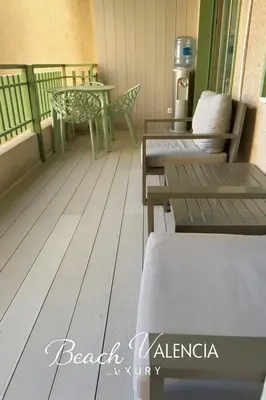 a room with a balcony with a table and chairs at BEACH VALENCIA LUXURY B7-23 Apartment with terrace and sea views in Valencia