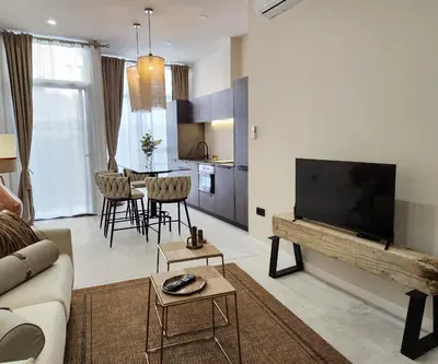 a living room with a couch and a flat screen tv at MD Pare Presentat in Valencia