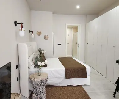 a bedroom with a bed and a vase of flowers on a table at MD Pare Presentat in Valencia