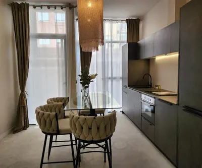 a kitchen with a glass table and two chairs at MD Pare Presentat in Valencia