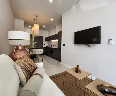 a living room with a couch and a flat screen tv at MD Pare Presentat in Valencia