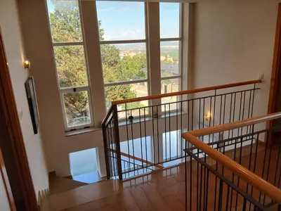 a room with a staircase with a large window at Casa en Valencia, piscina, cerca de golf, playas, moto Gp in Valencia