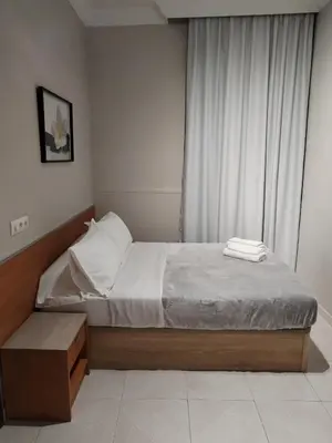 a bedroom with a bed and a window at Pensión A&E in Manises