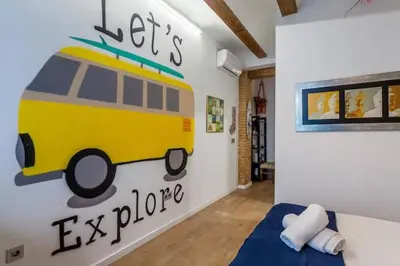 a bedroom with a yellow bus mural on the wall at RUZAFA COOL LOFT in Valencia