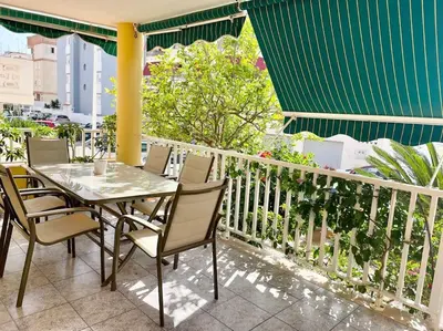 a table and chairs on the balcony of a building at 3-bedroom apartment with terrace on ground floor in Moncófar